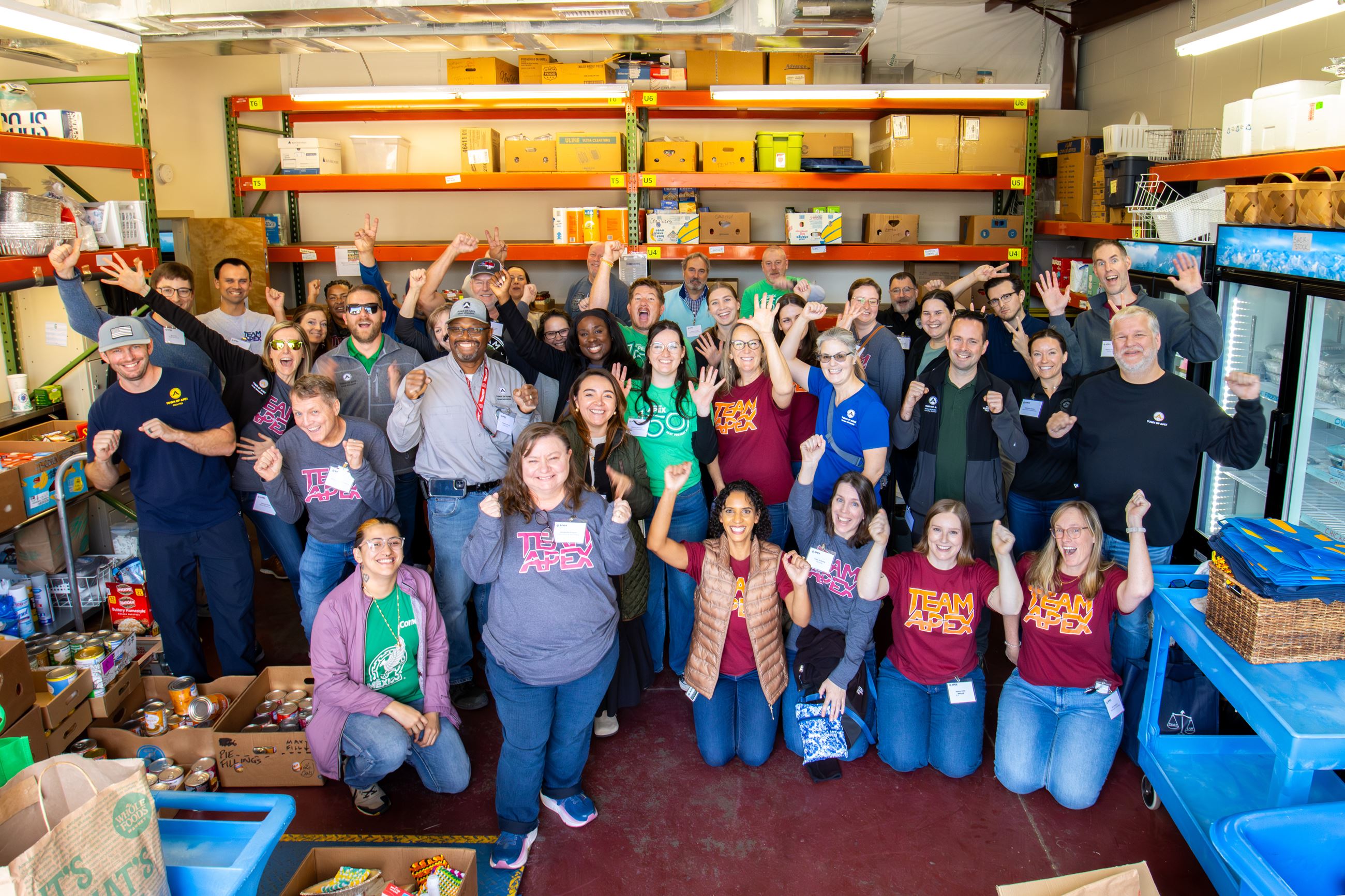 Apex Employees volunteering at Western Wake Crisis Ministry for their annual Team Apex Service Day